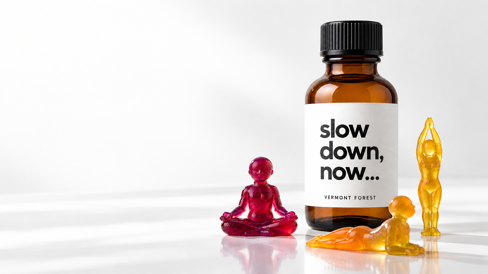 Slow Down Now bottle concept with jewel-colored yoga gummies on a clean white surface